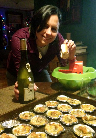 Julie enjoying baked oysters and Muscadet wine