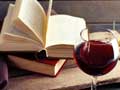 open book and glass of wine